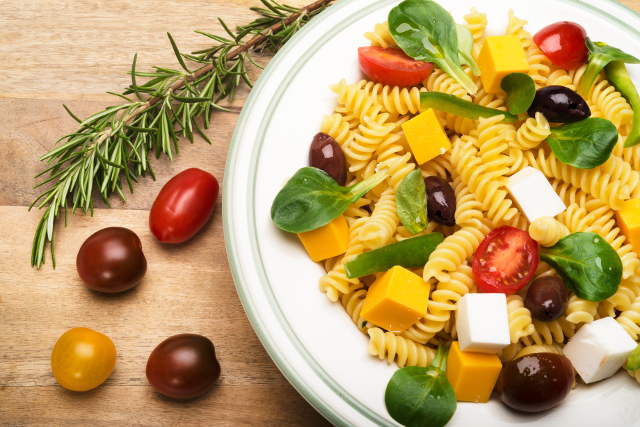 Vegan Dairy-Free Plant Based Lifestyle Cold mixed plate with macaroni olives tomato and vegan cheese