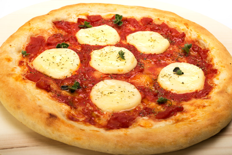 Vegan Dairy-free Plant Based Diet Delicious Pizza with Mozzarella Flavour Cheese 4 servings plate