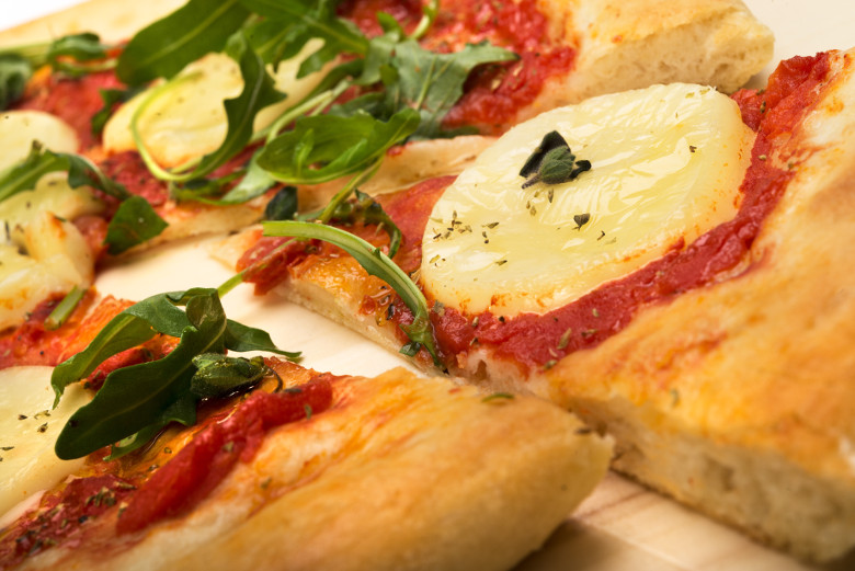 Vegan Dairy-free Plant Based Diet Delicious Pizza with Rocket and Mozzarella Flavour Cheese 4 servings plate